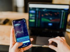 trading crypto on mobile device and laptop